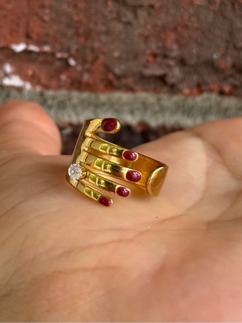 Red nails hand shaped ring